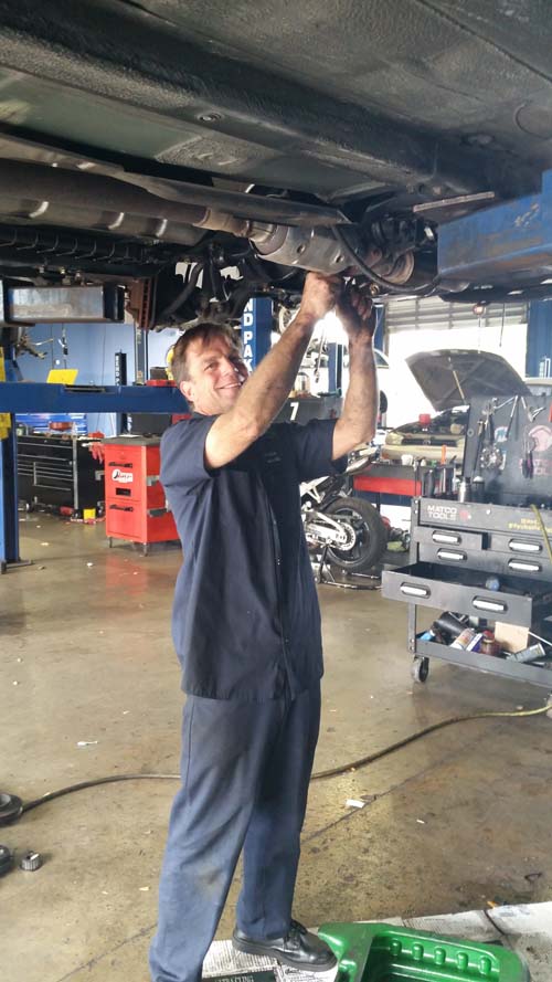One of our ASE Certified Technicians at work in our garage.